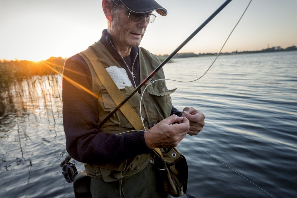 Fisherman preparing a rod for Rick and Bubba Outdoor Expo