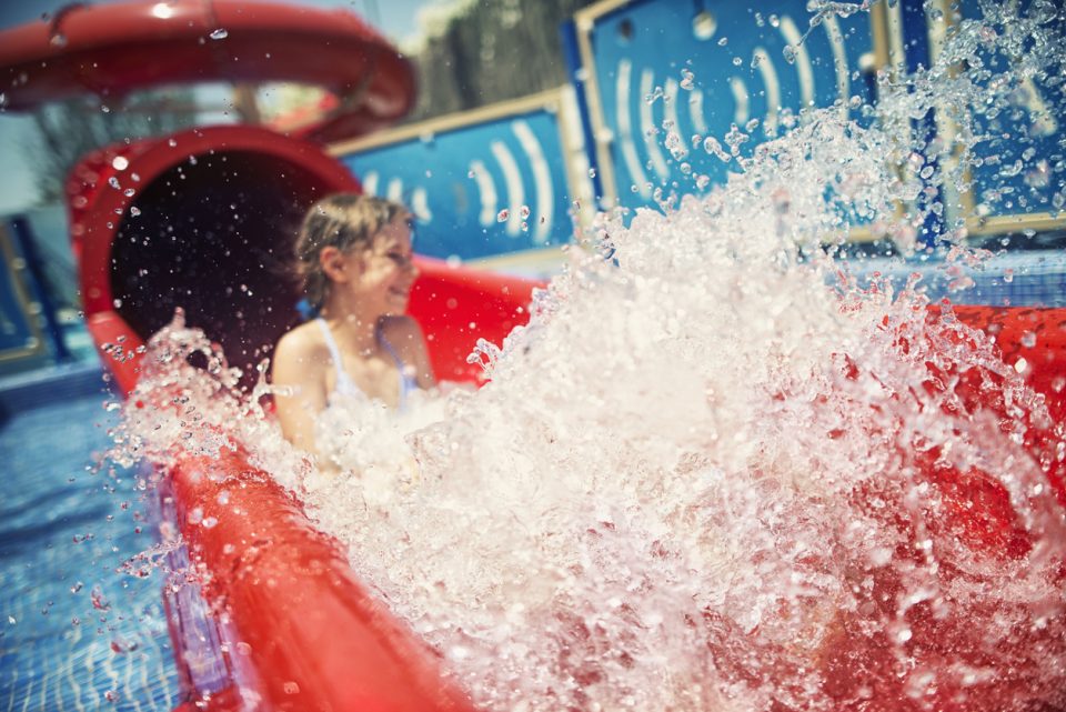 Little girl on a water slide at Alabama Splash Adventure