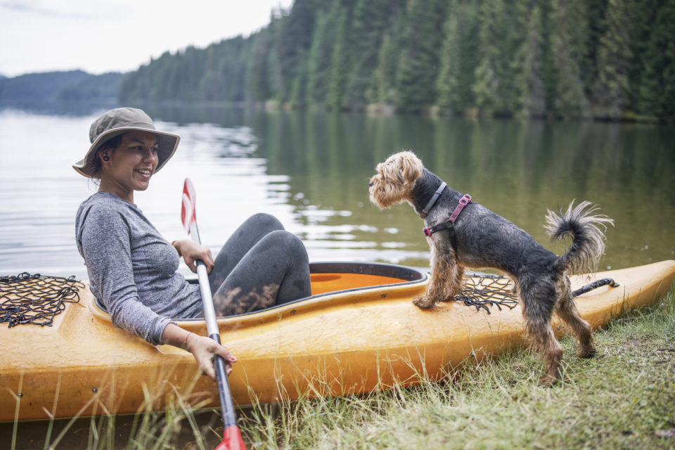 Woman Enjoying Vacation With Her Dog.