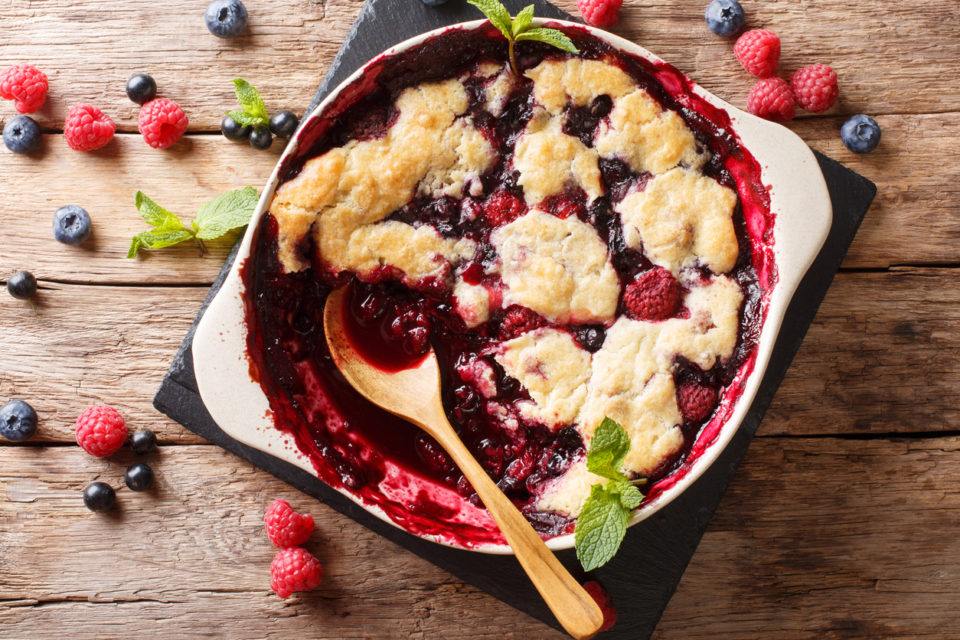 Mixed berry cobbler on a wooden table