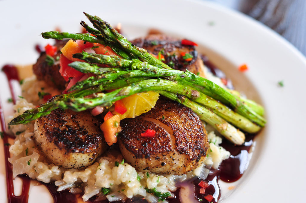 Plate of Scallops and Asparagus over Risotto