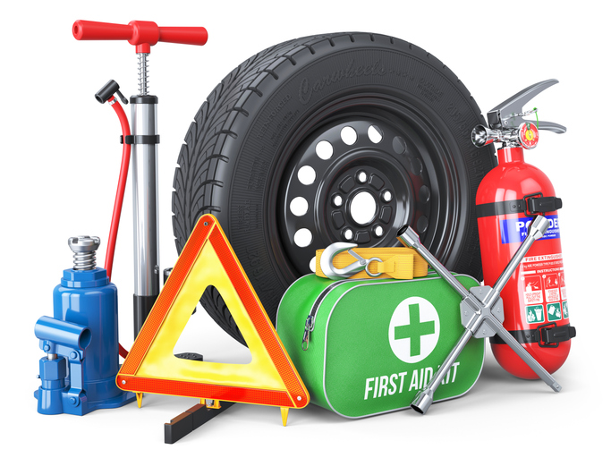 A set of automotive accessories. Spare wheel, fire extinguisher, first aid kit, emergency warning triangle, jack, tow rope, wheel wrench, pump. Objects isolated on white background. 3d